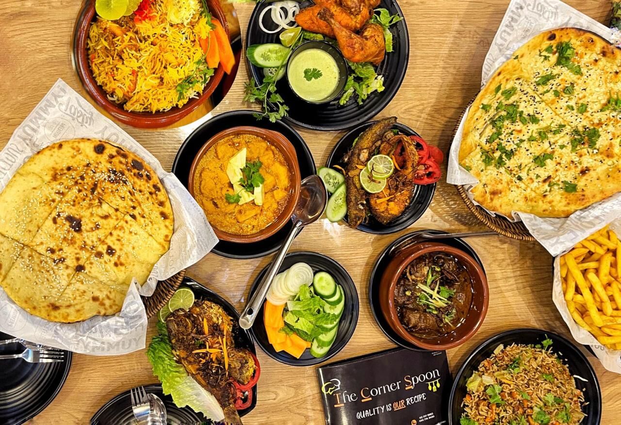 The Corner Spoon spread of biryani, karahi, naan and Pakistani dishes